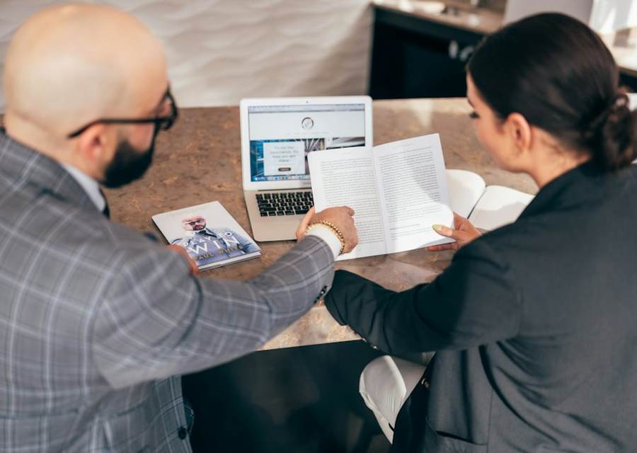 Accountant reading a letter at a conference table
